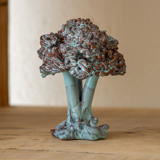Small olive tree in iridescent Tiffany green