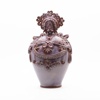 Iridescent pink ceramic doll